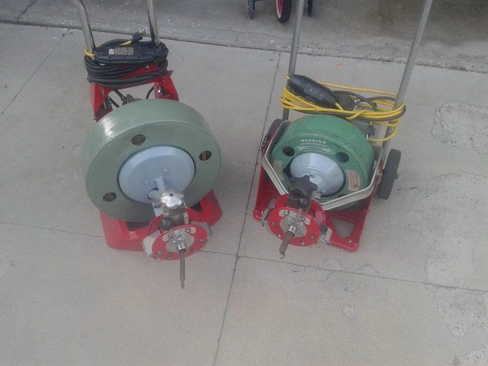 Two drum drain-cleaning machines ready for a rooter job