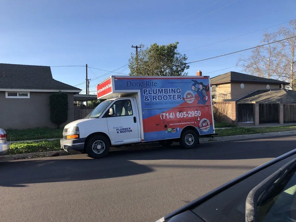 Done-Rite Plumbing & Rooter box truck parked on a residential street